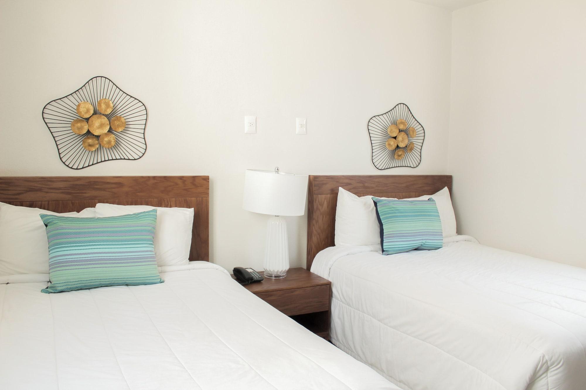 Suite junior, 2 camas dobles, vista parcial al océano