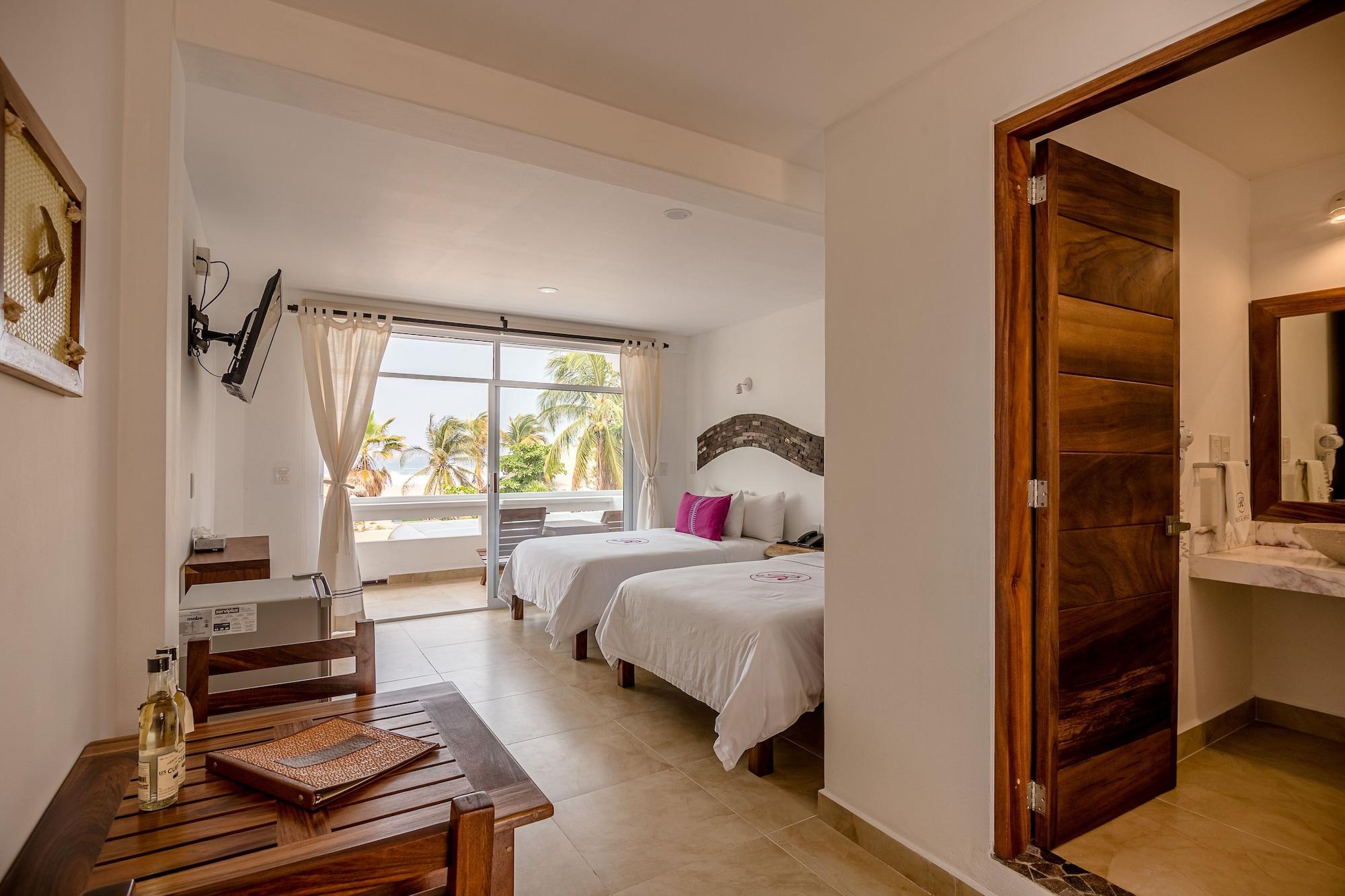 Habitación Deluxe, 2 camas dobles, vista parcial al mar