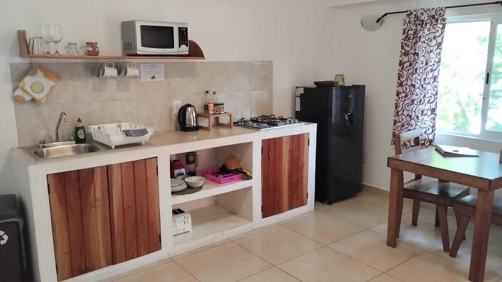 Suite estudio Confort, 1 cama King size, cocina, vista al jardín