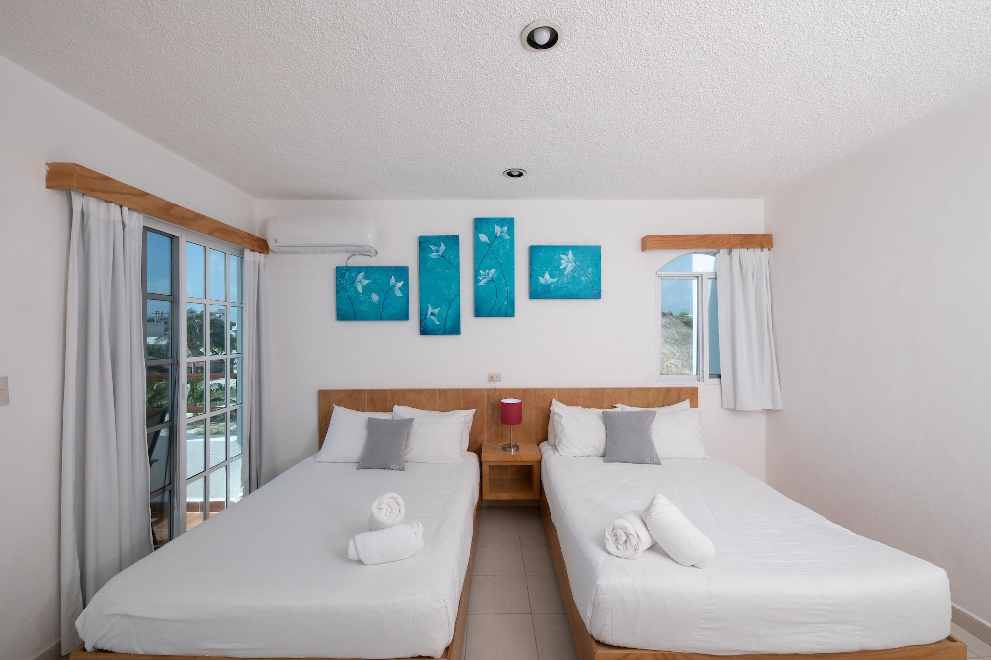 Habitación Deluxe, 2 camas dobles, vista parcial al océano