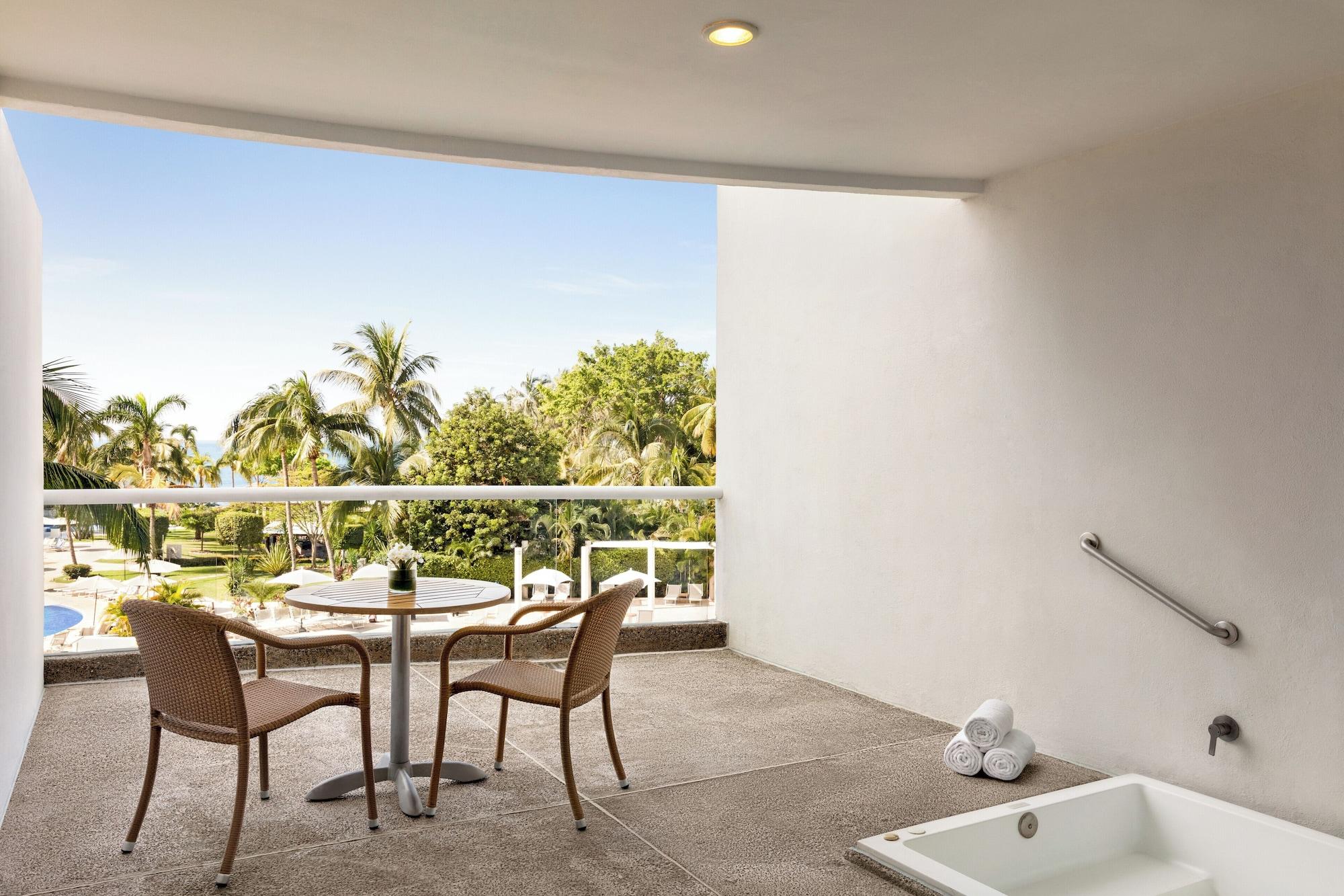 Suite junior, 2 camas dobles, vista parcial al océano