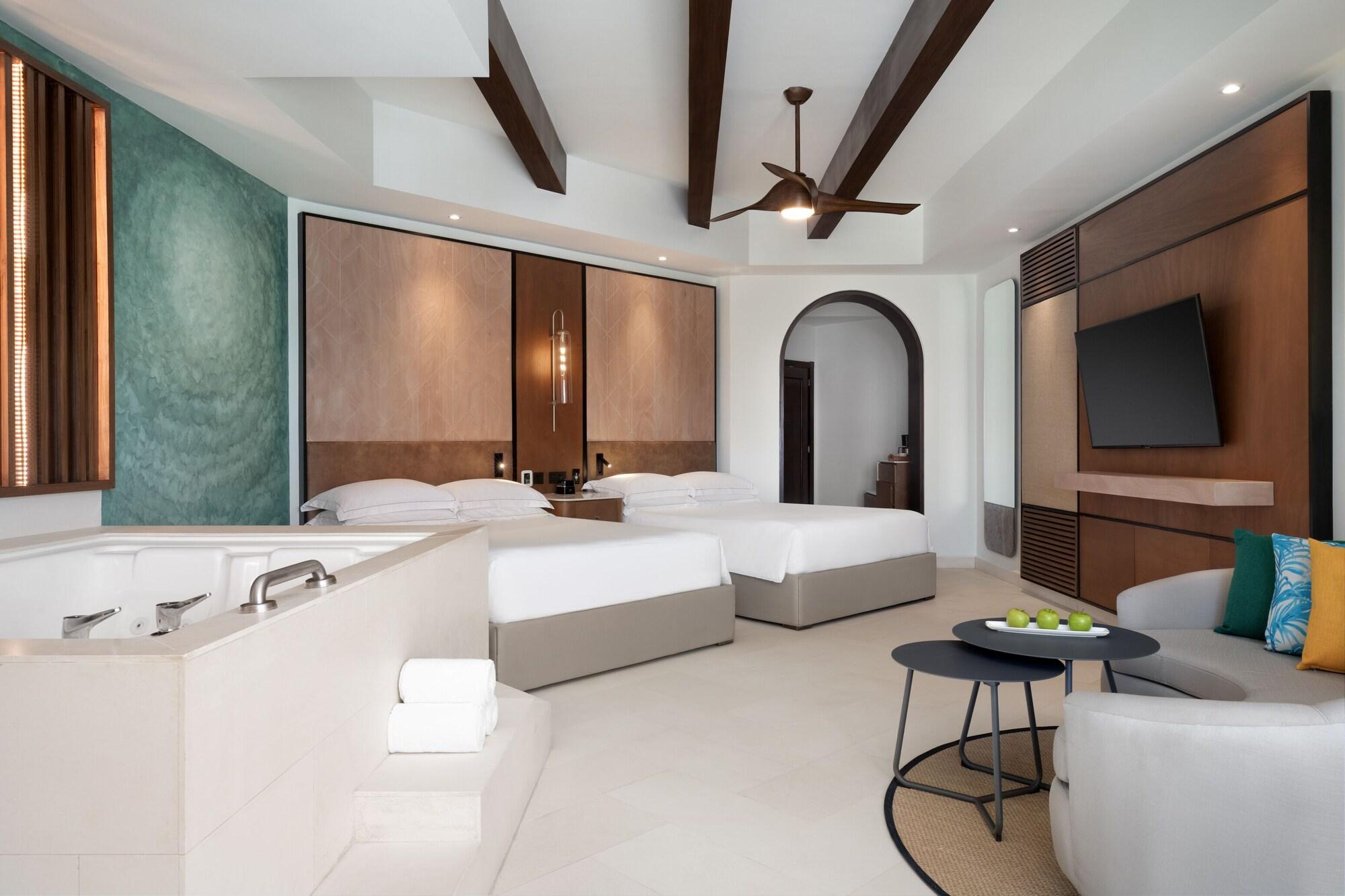 Suite junior, 2 camas Queen size, vista a la piscina