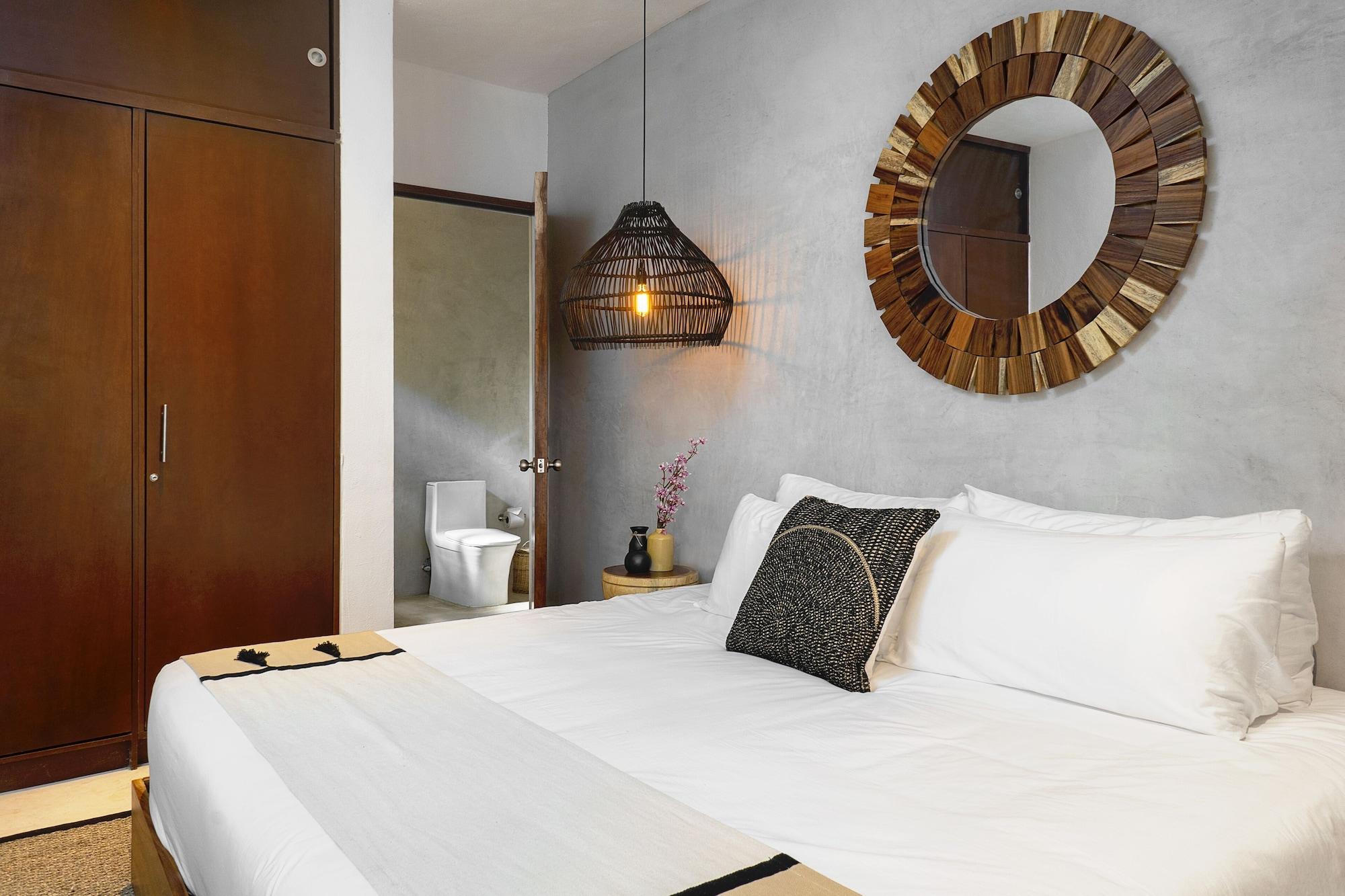 Suite de diseño, 1 cama Queen size con sofá cama, balcón, vista al jardín
