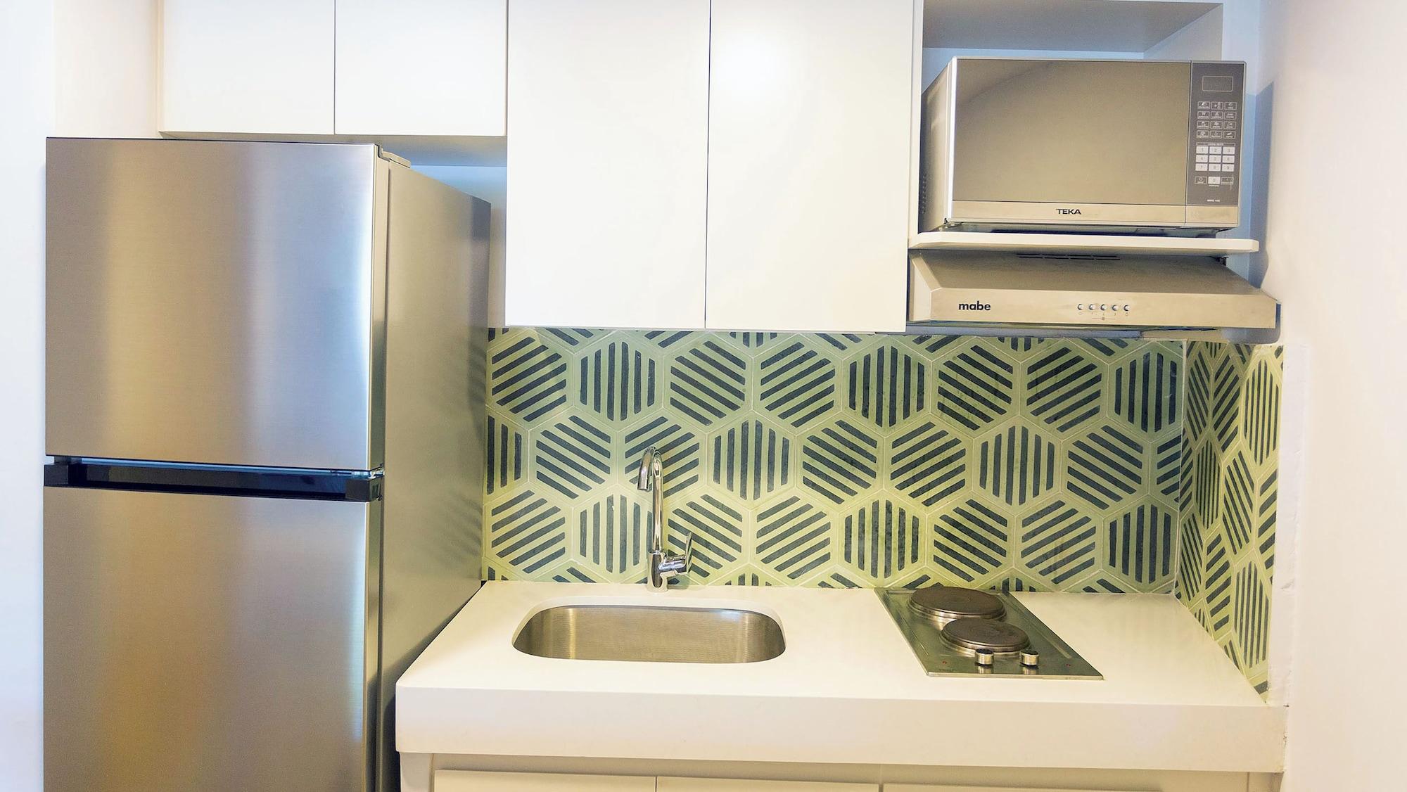 Suite junior, kitchenette, vista al jardín