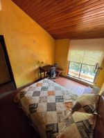 Alquiler Vacacional - A colorful, peaceful oasis in Girardot, a bright family home designed for rest.