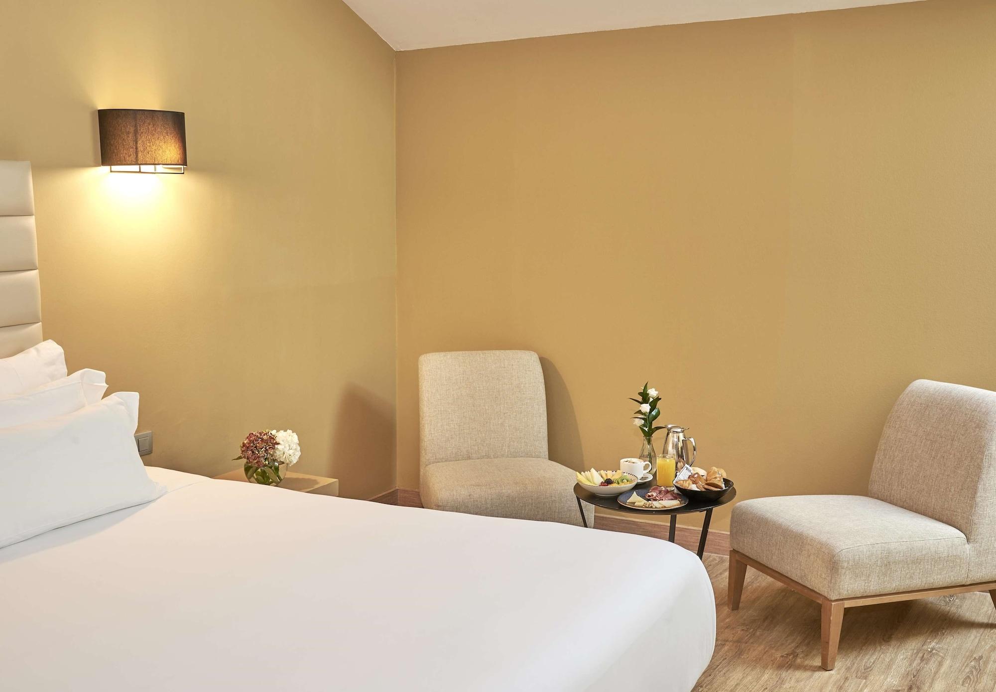 Habitación NH Collection Cáceres Palacio de Oquendo