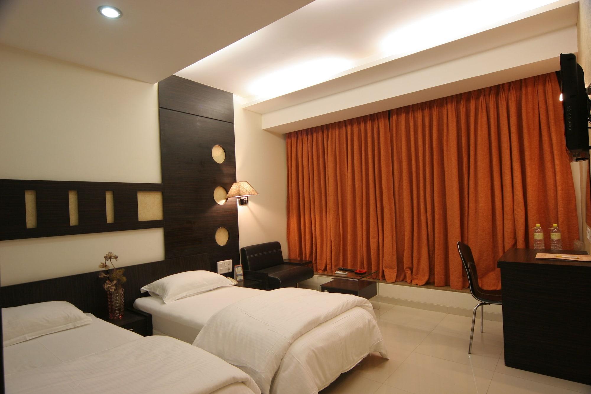 Habitación Pride Biznotel Alkapuri