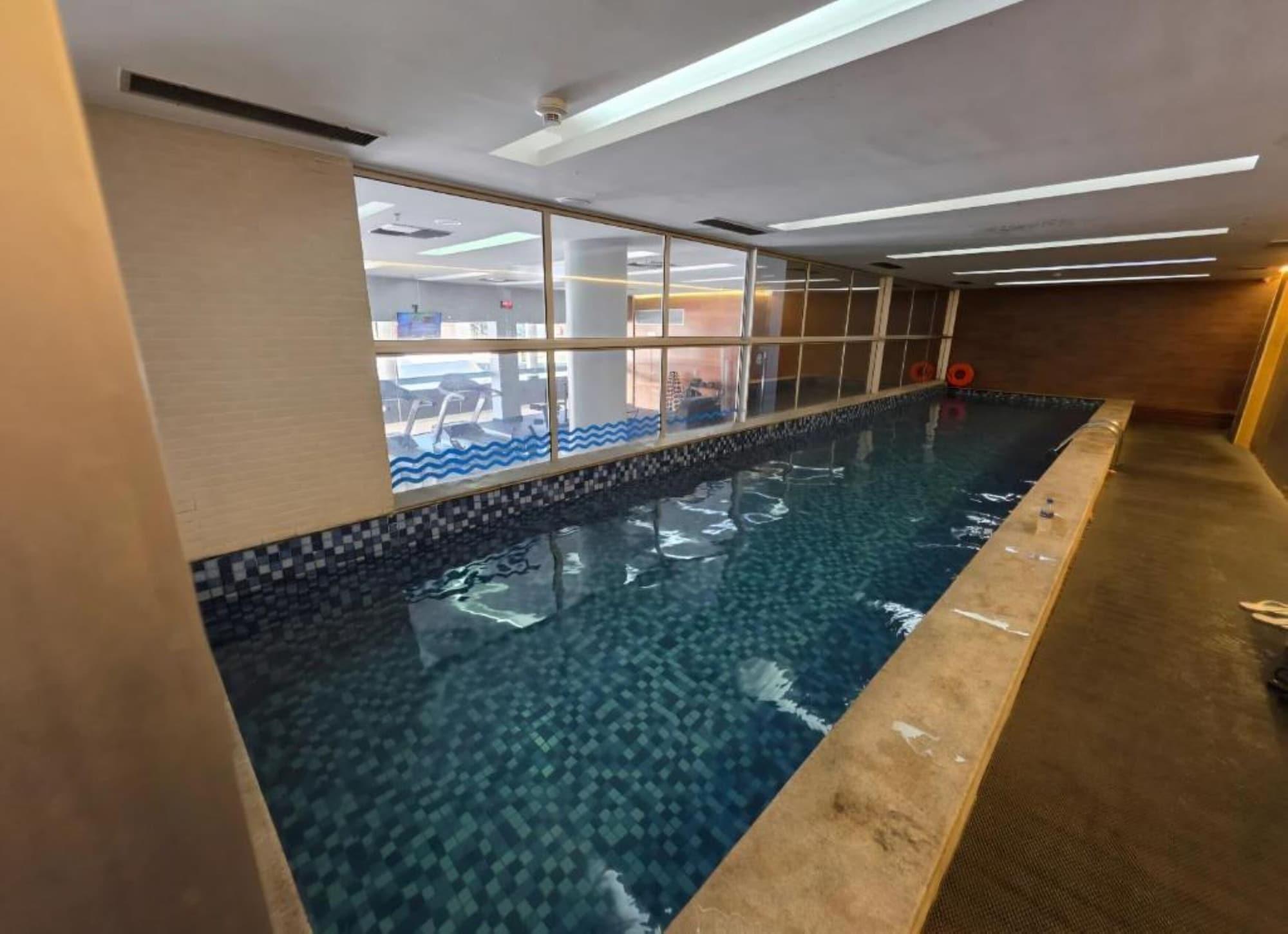 Vista Piscina Flat com vista linda no Hotel Vision