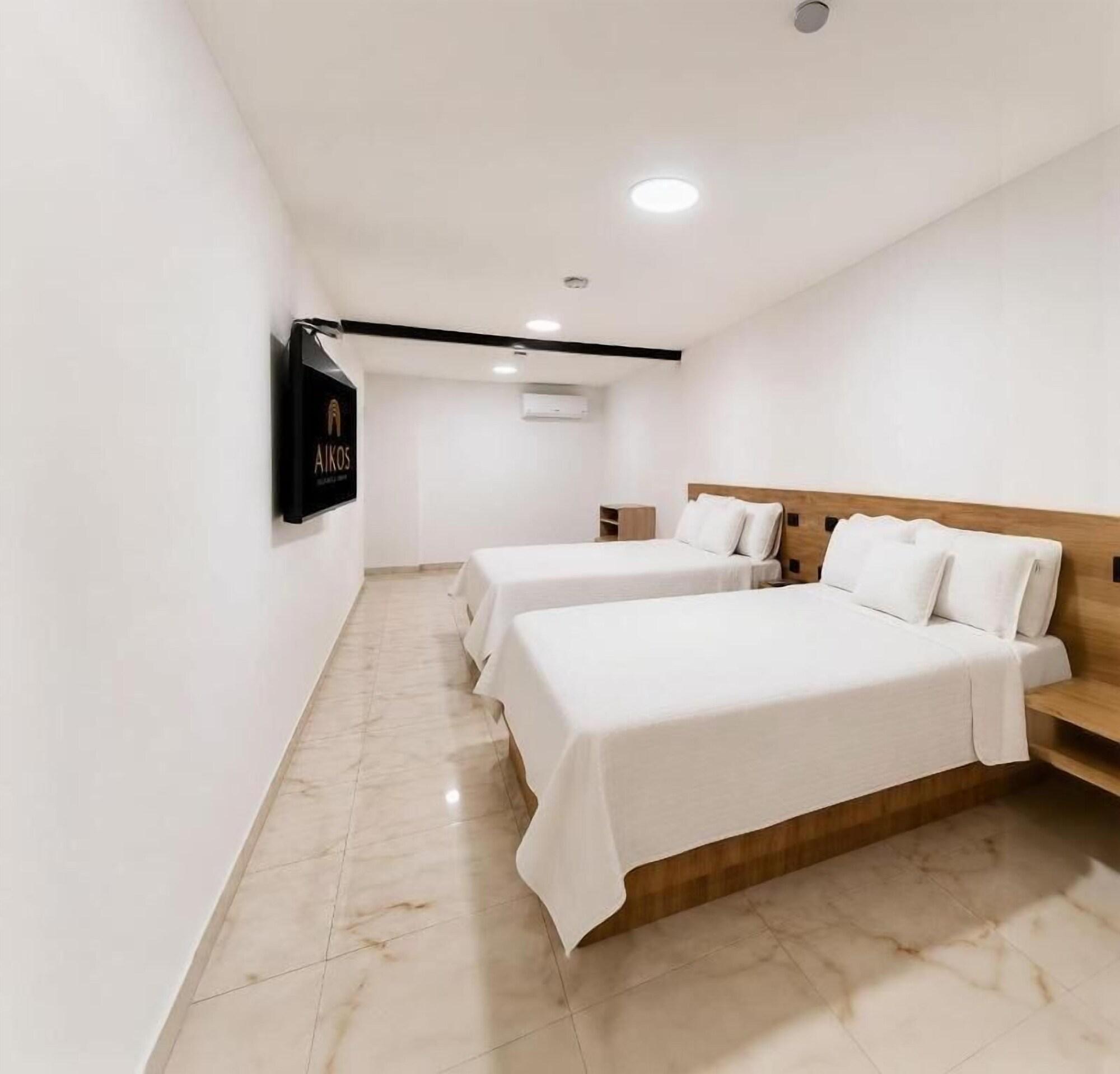 Habitación HOTEL AIKOS