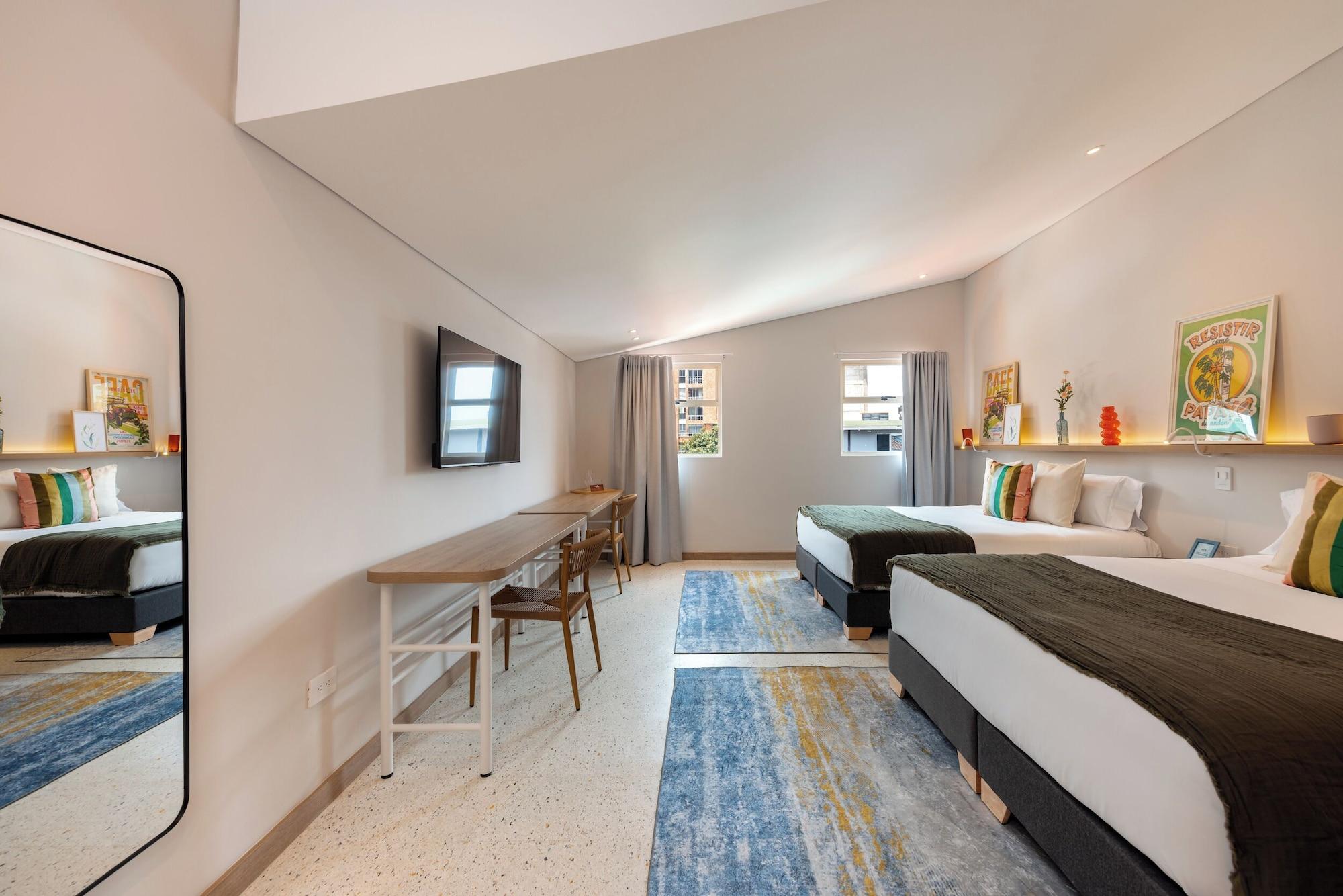 Quarto Medellinn The Blooming Hotel