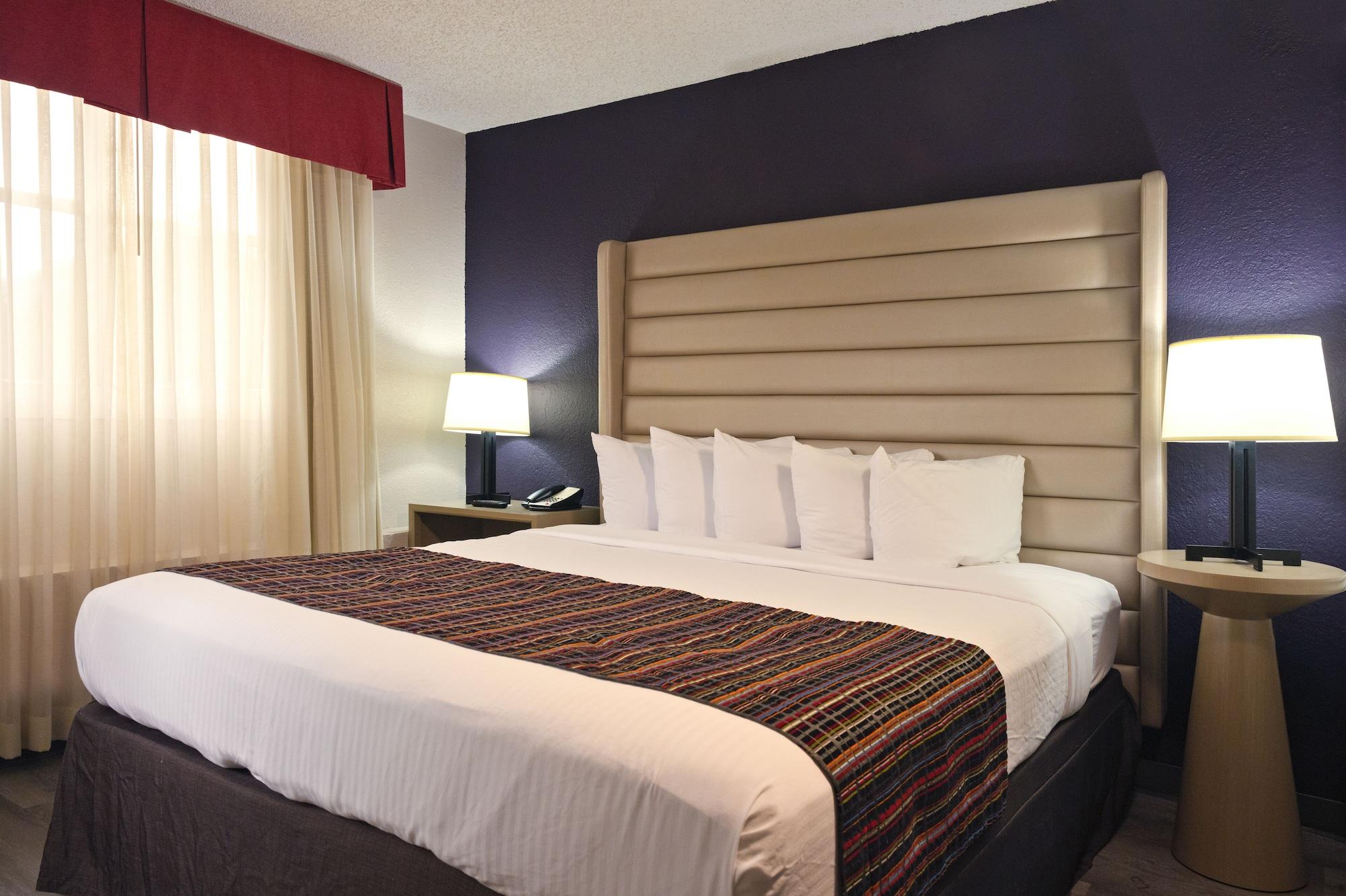 Habitación The Palms Inn & Suites
