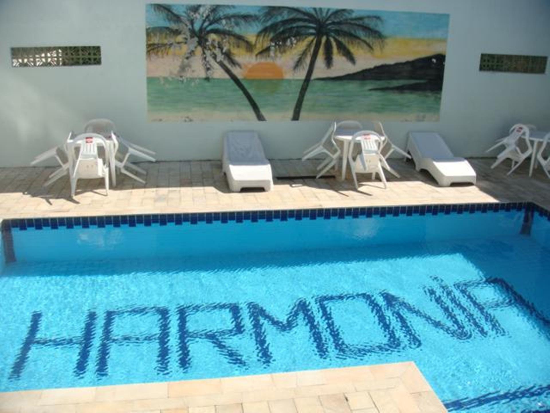 Vista da piscina Hotel Harmonia Vila Caiçara
