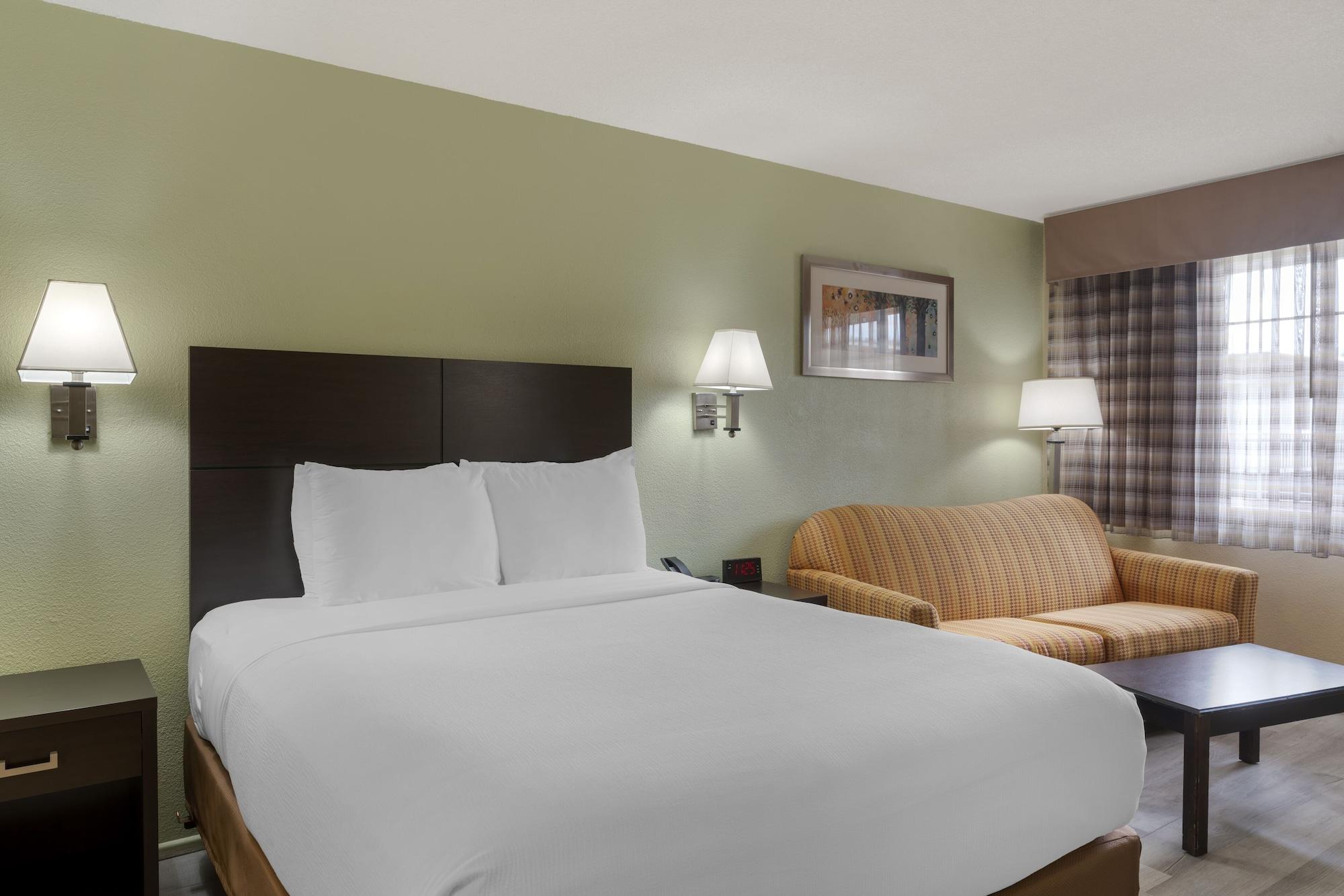 Habitación University Inn & Suites