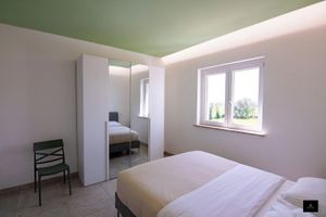 Alquiler Vacacional - Air-conditioned apartment in greenery in a structure  swimming pool and E-bike
