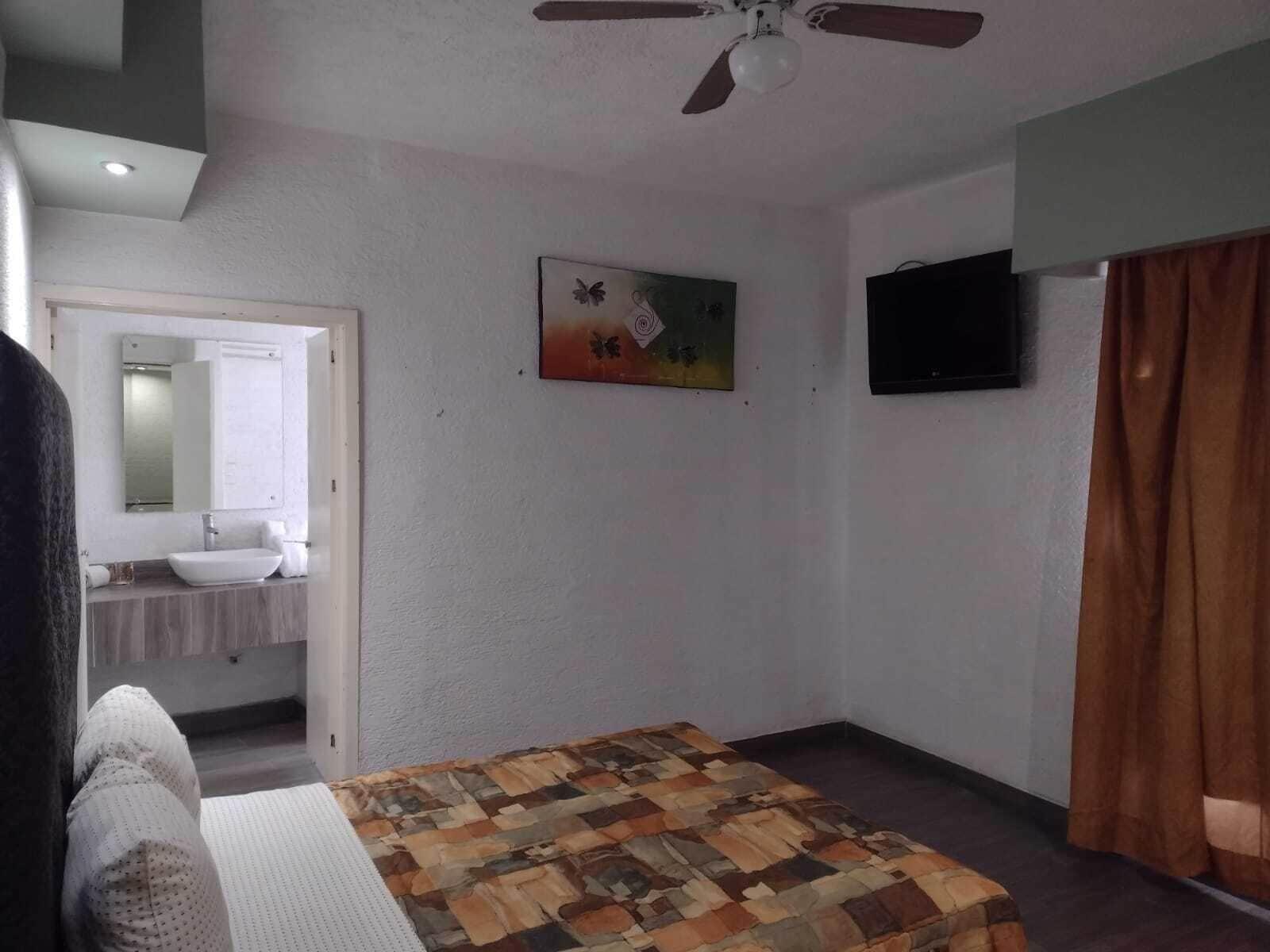 Habitación Hotel Metropolitan