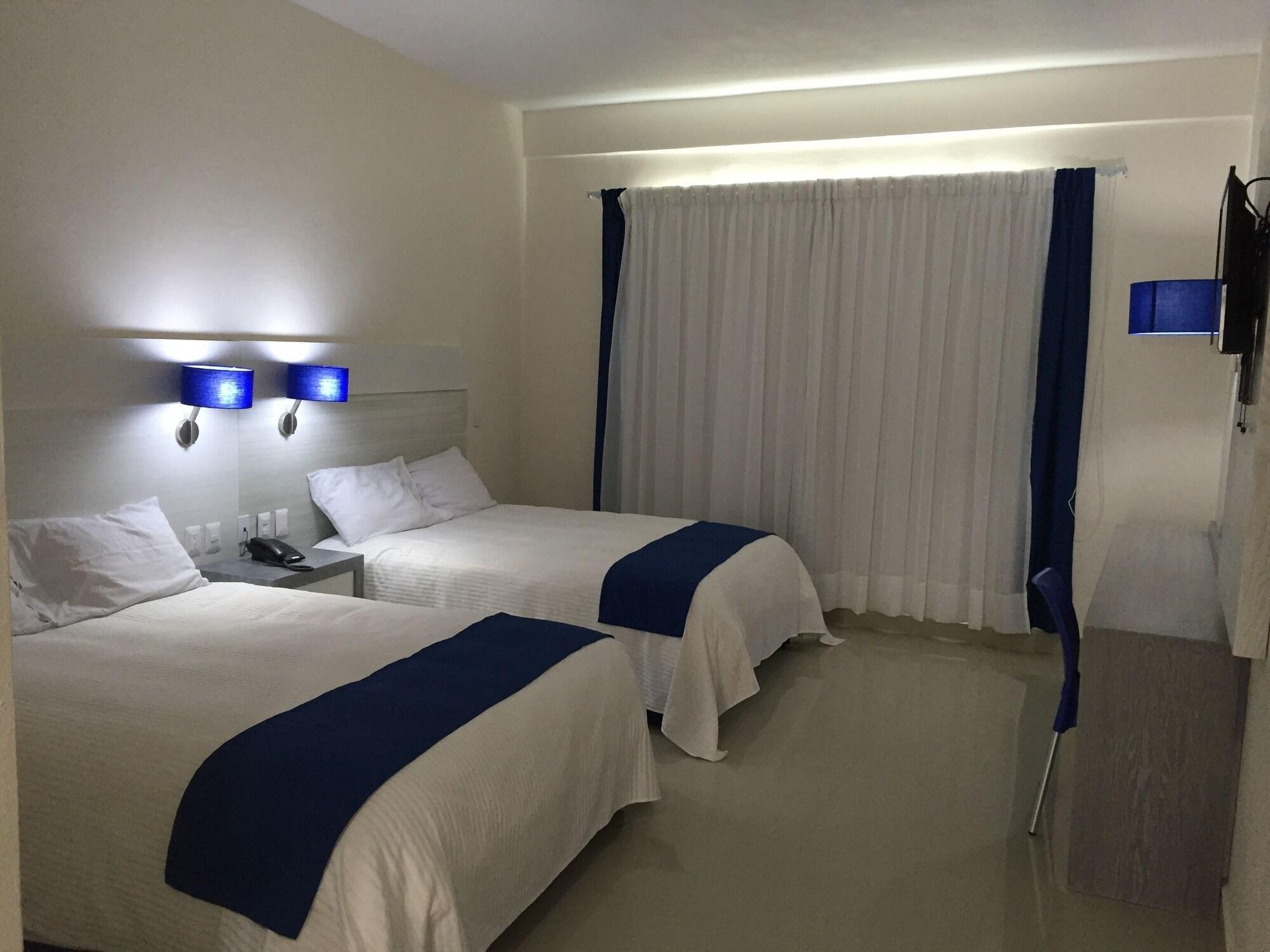 Habitación MH Grand Hotel