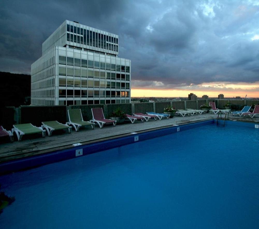 Vista da piscina Hotel Le Cantlie Suites