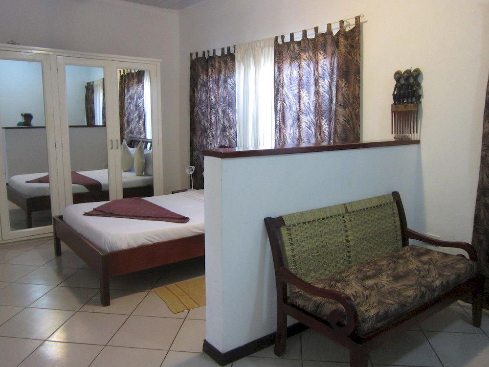 Habitación La Paradise Inn