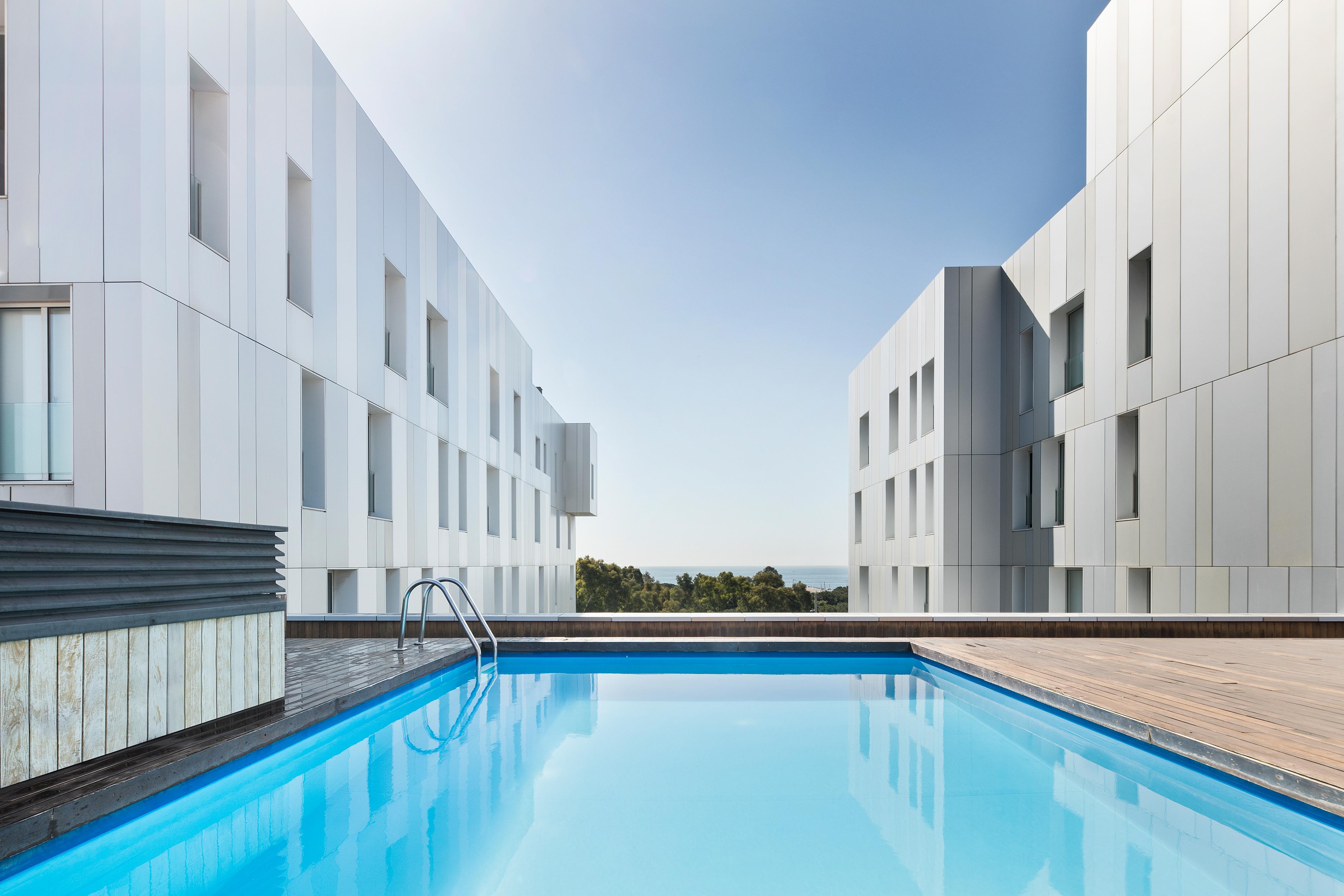 Vista Piscina Lugaris Beach - Apartments