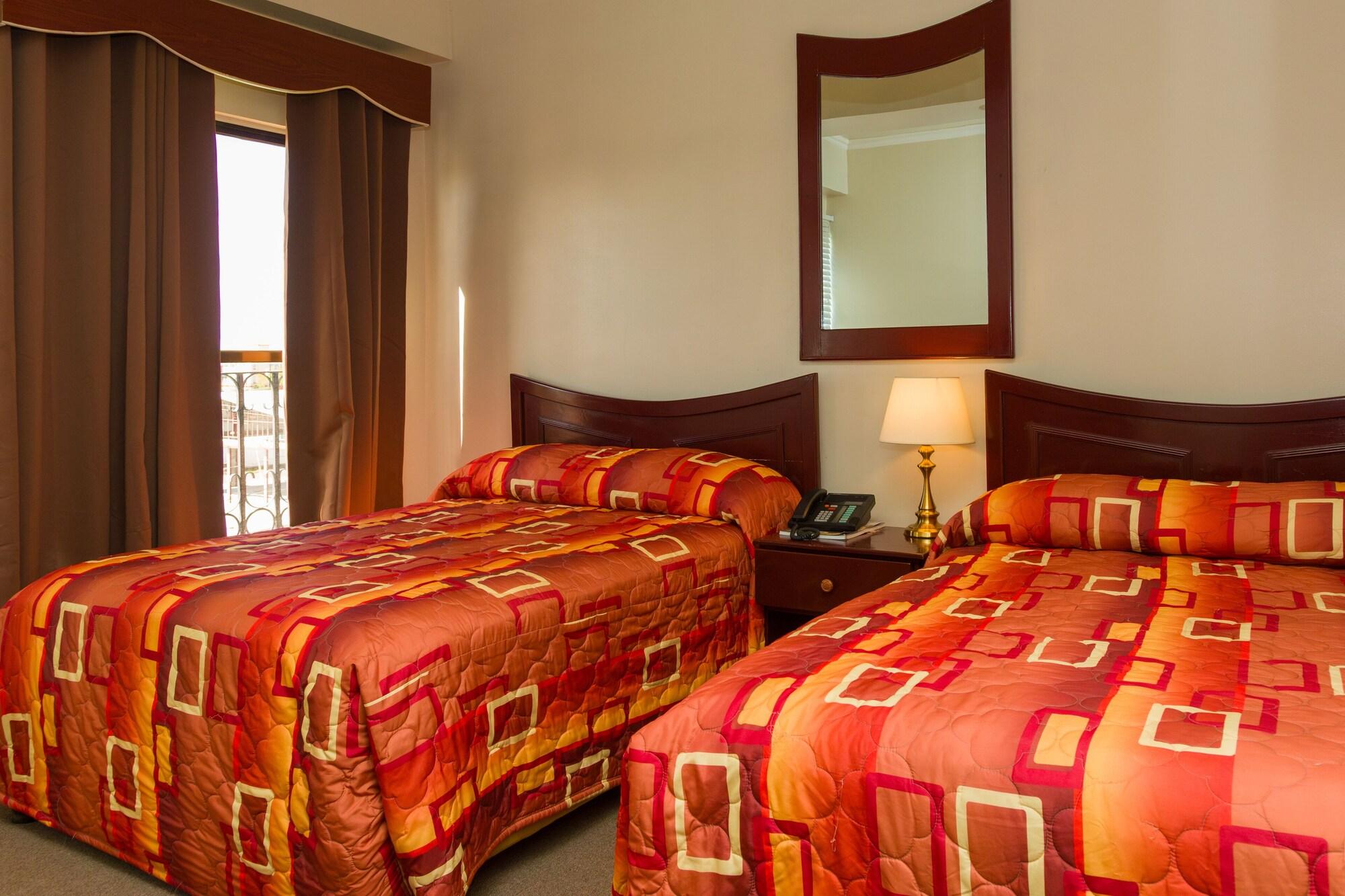 Habitación Regency Suites Hotel