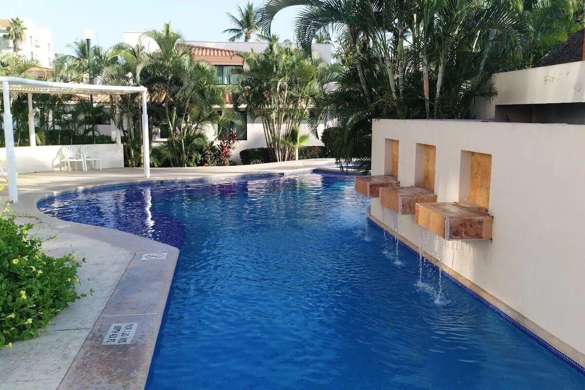 Vista Piscina CONDO MARINA FIESTA by TRVL2HM