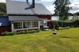 Alquiler Vacacional - Rotes Holzhaus am See