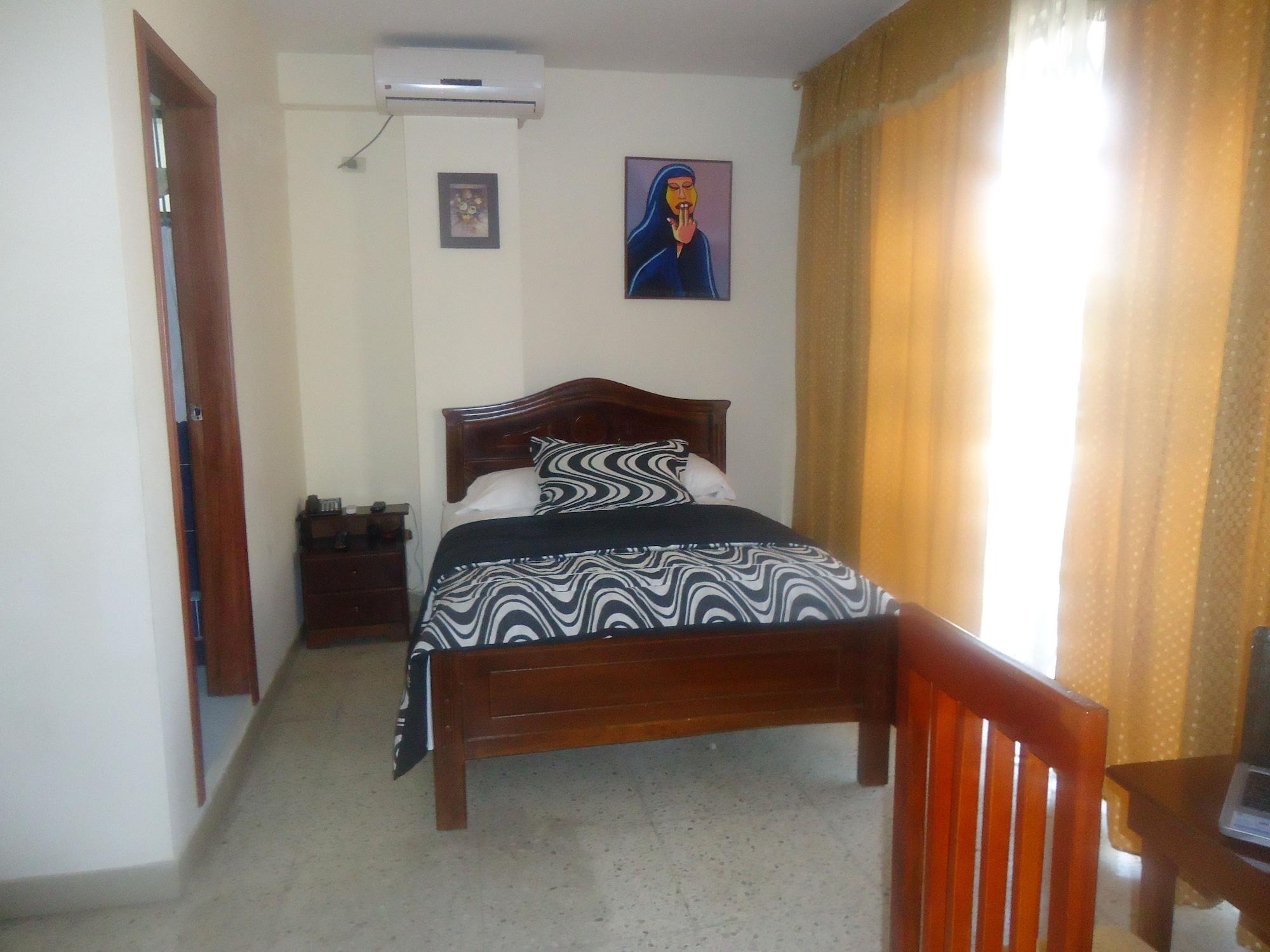 Habitación Hostal Perla Real Inn