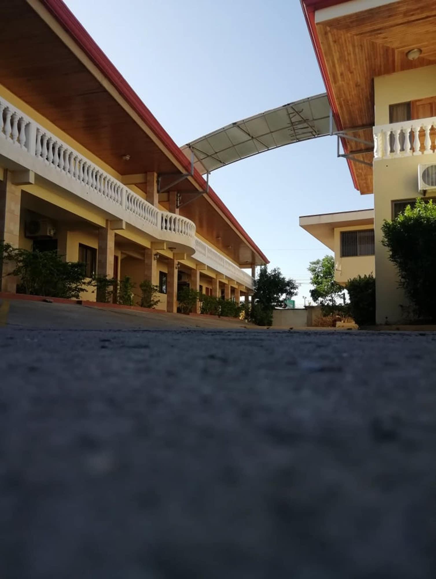 Vista Exterior Hotel Kam Tu