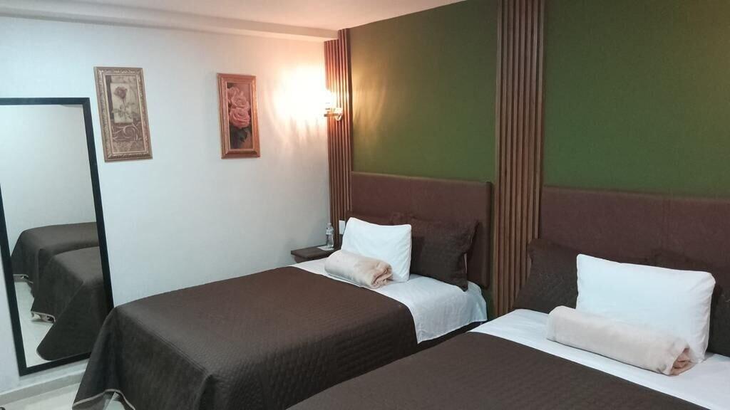 Habitación Royal Madero Inn Express