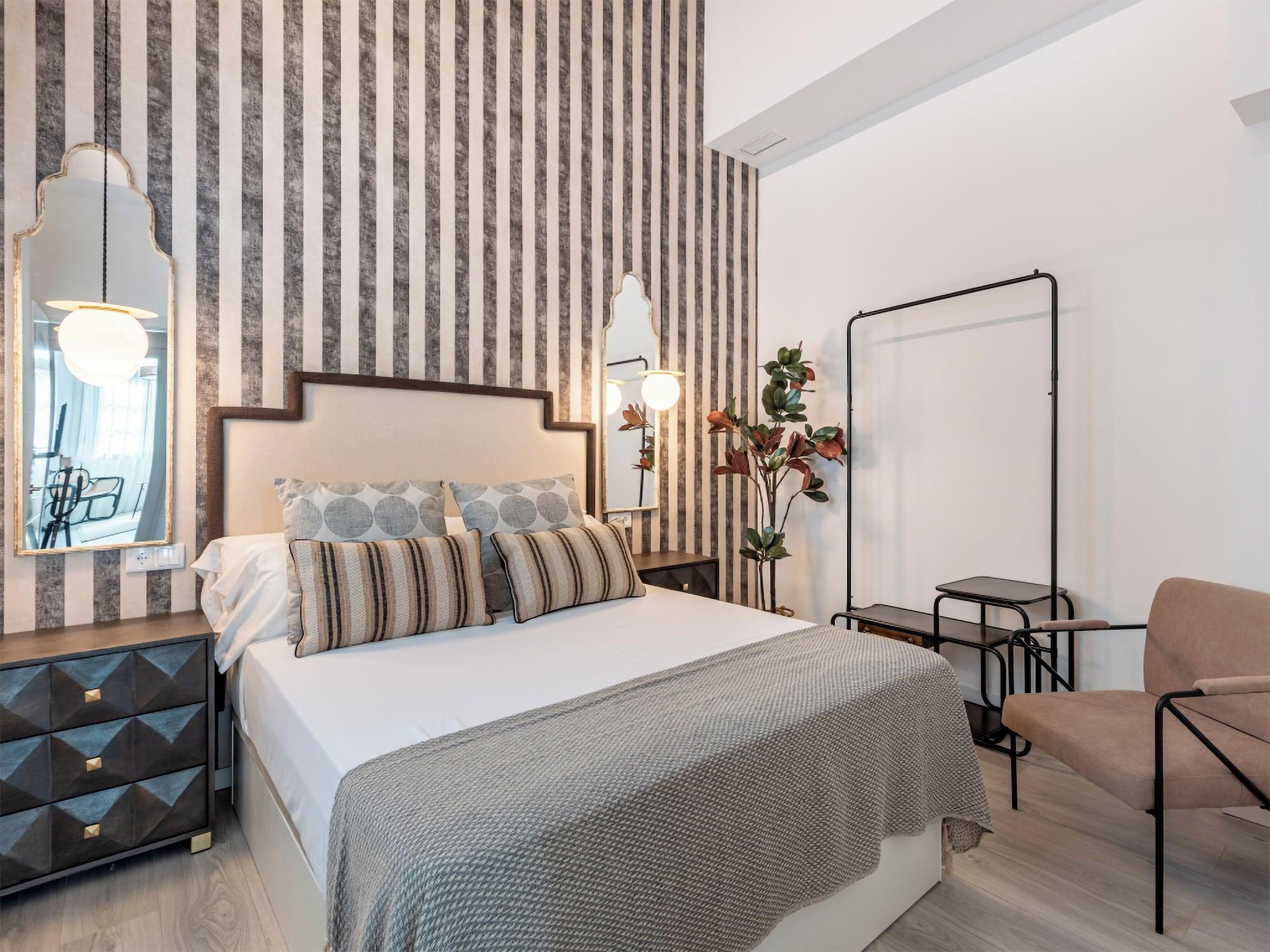 Habitación Apartamentos Puerta Elvira Suites 3000