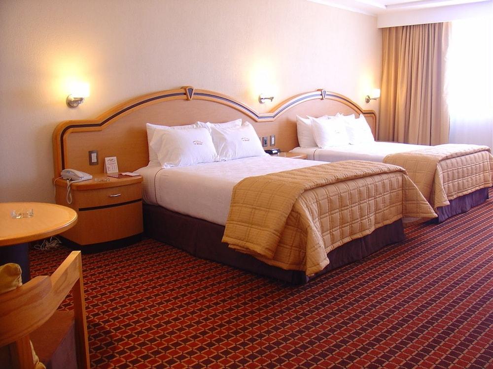 Guest room Suites Inn La Muralla Metepec