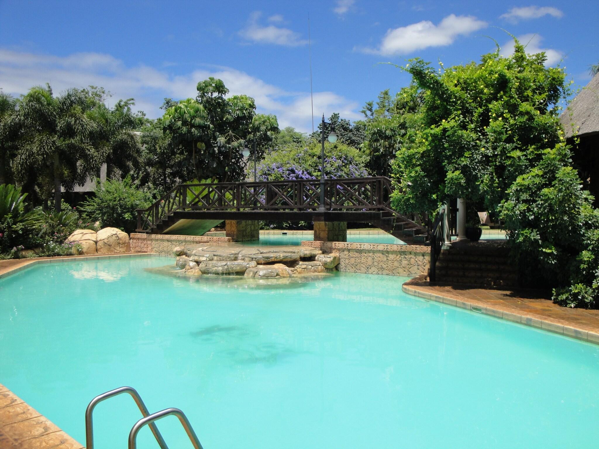 Vista Piscina Summerfield Luxury Resort & Botanical Garden