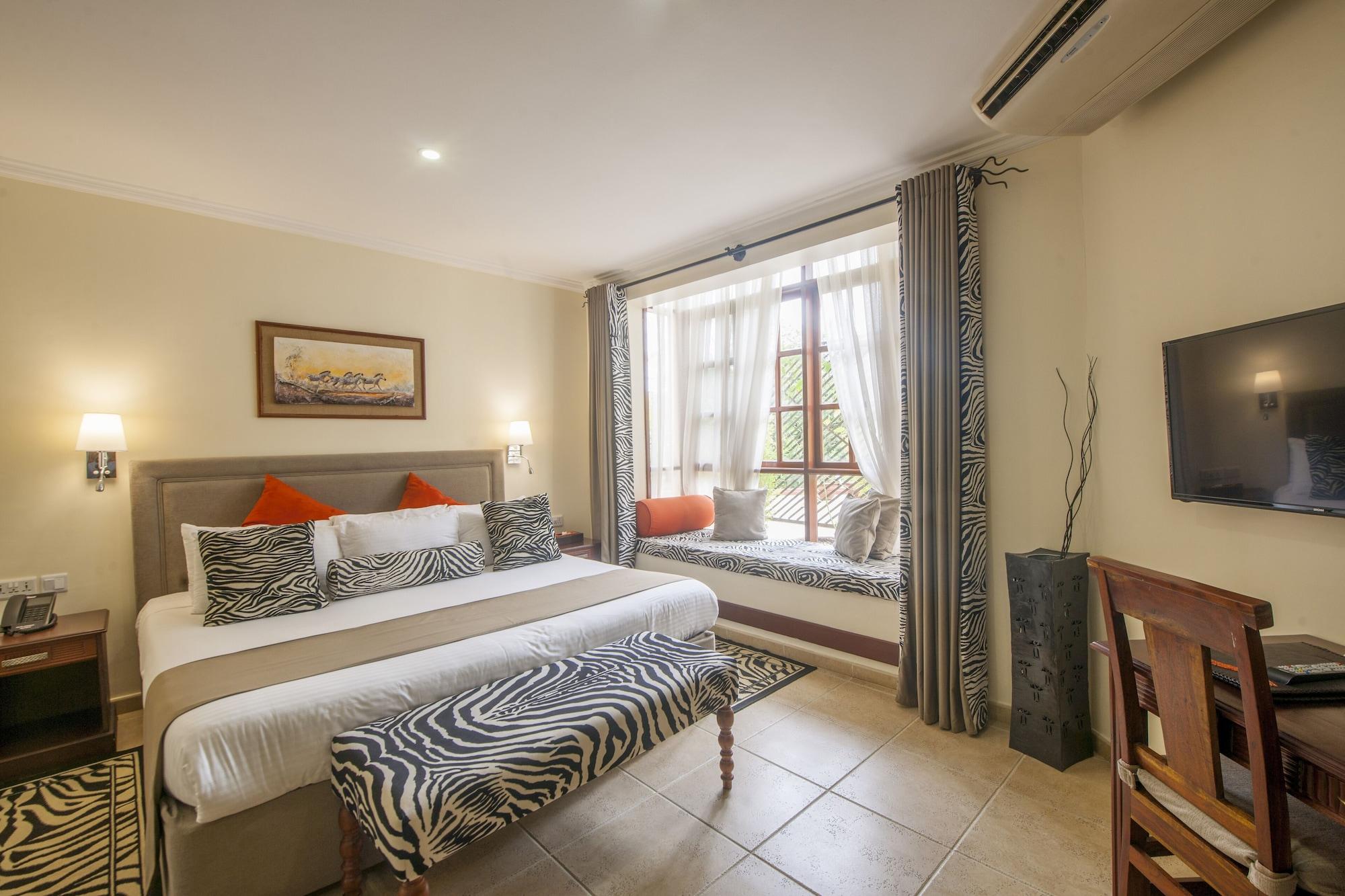 Habitación The African Tulip Hotel