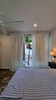 Alquiler Vacacional - On very private beach, top views apartment with a small reef and coconut trees