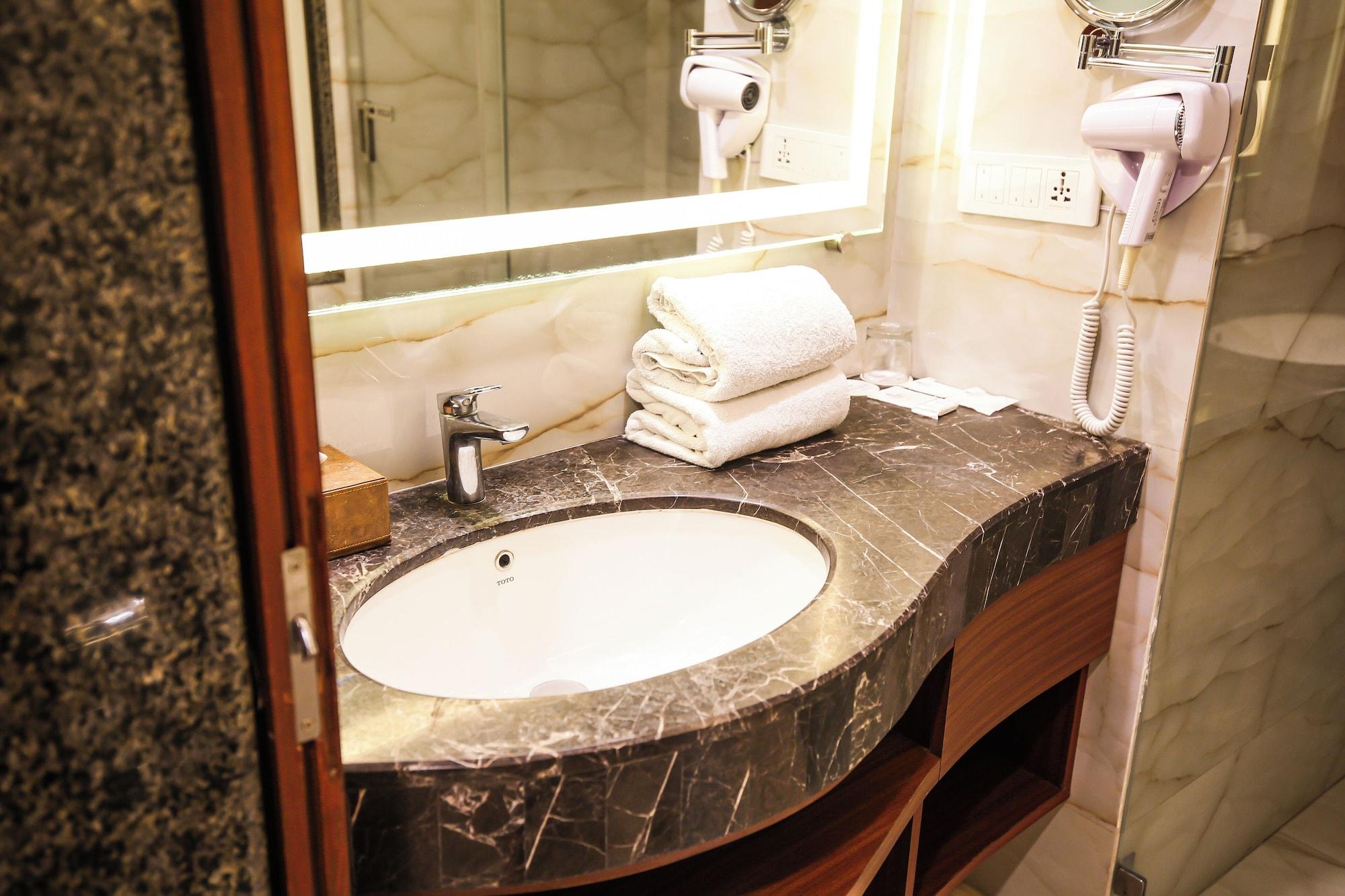 Comodidades do quarto PRISTINE HOTEL