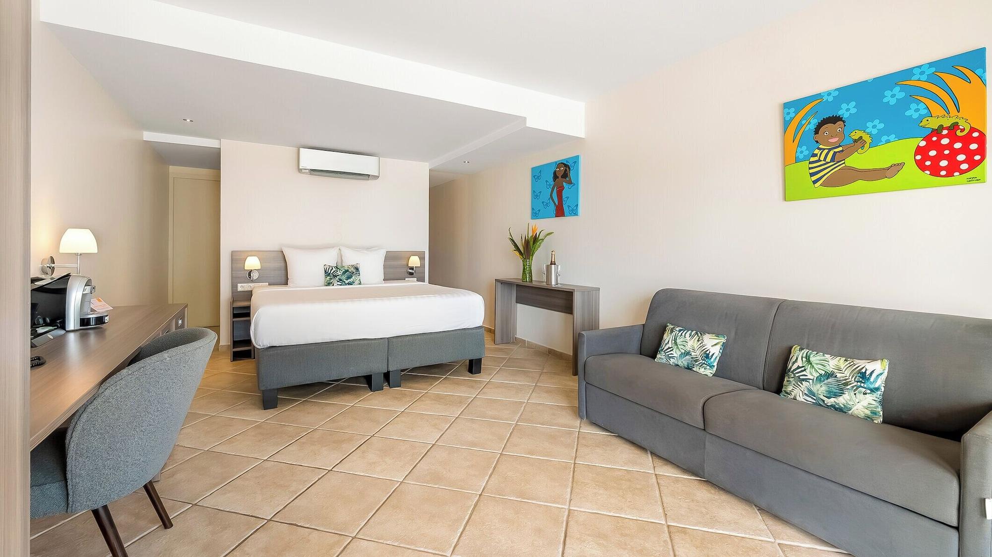 Habitación LionsDive Beach Resort