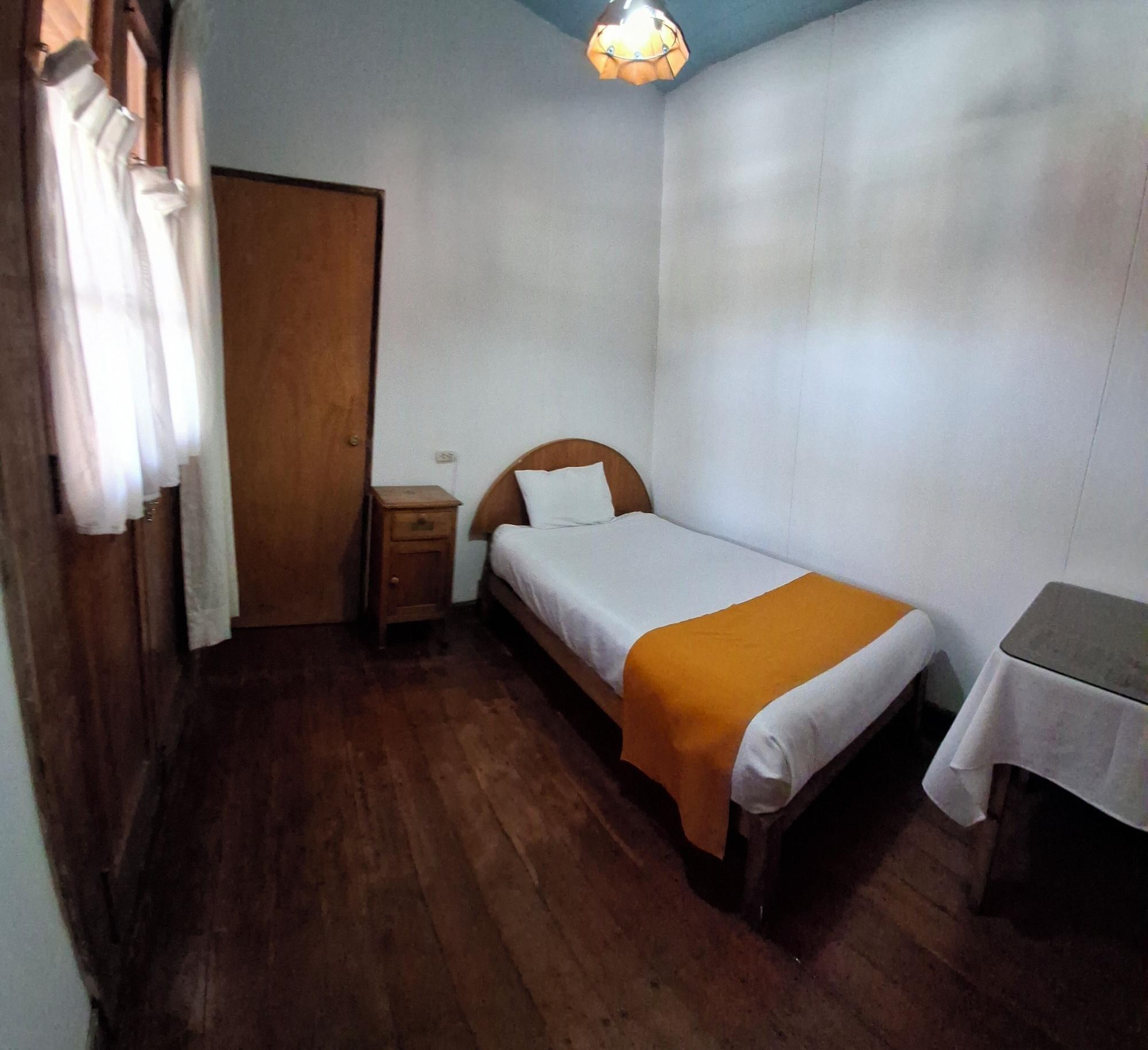 Habitación Hostal Lluvia de Oro