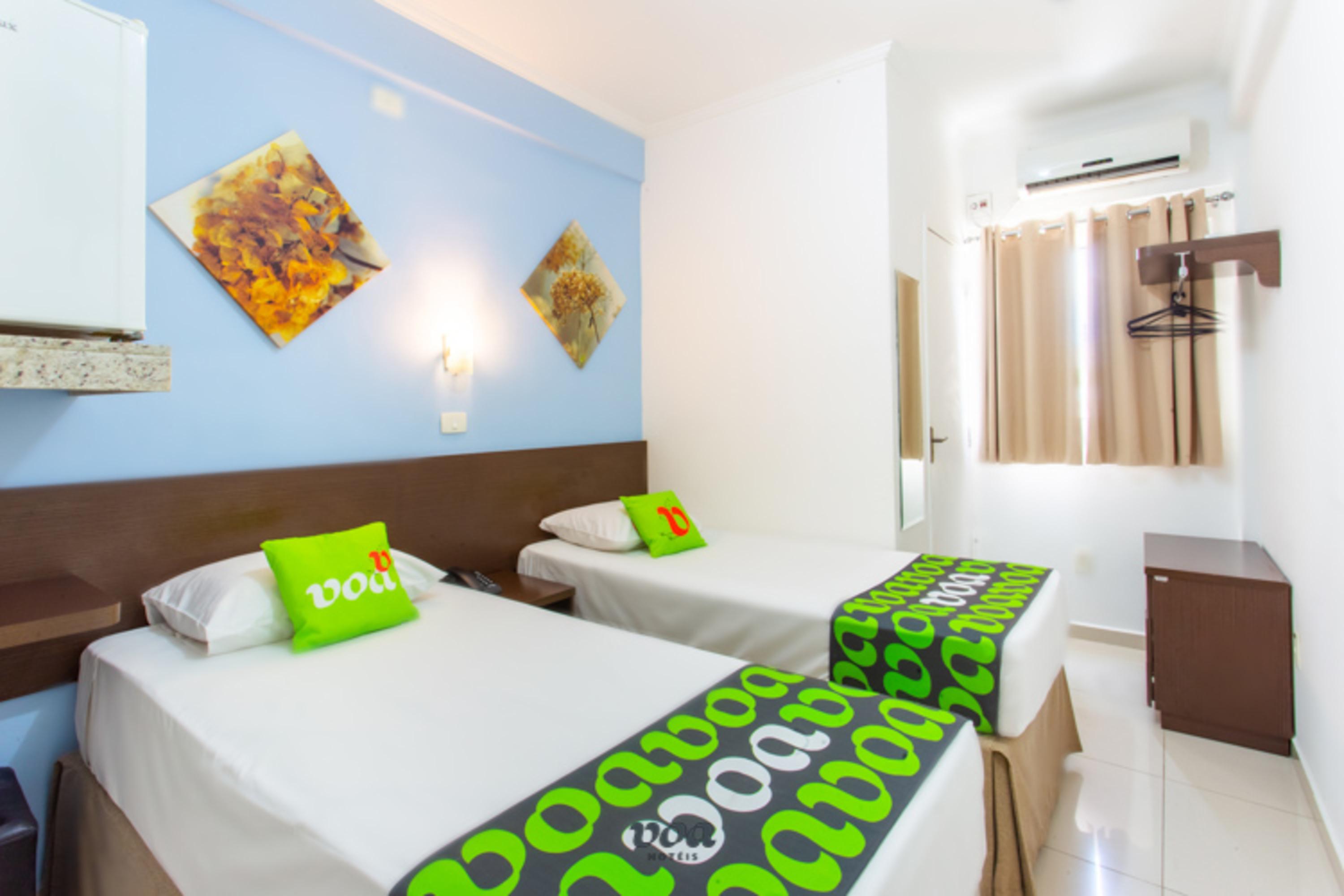 Quarto VOA Convenience Hotel