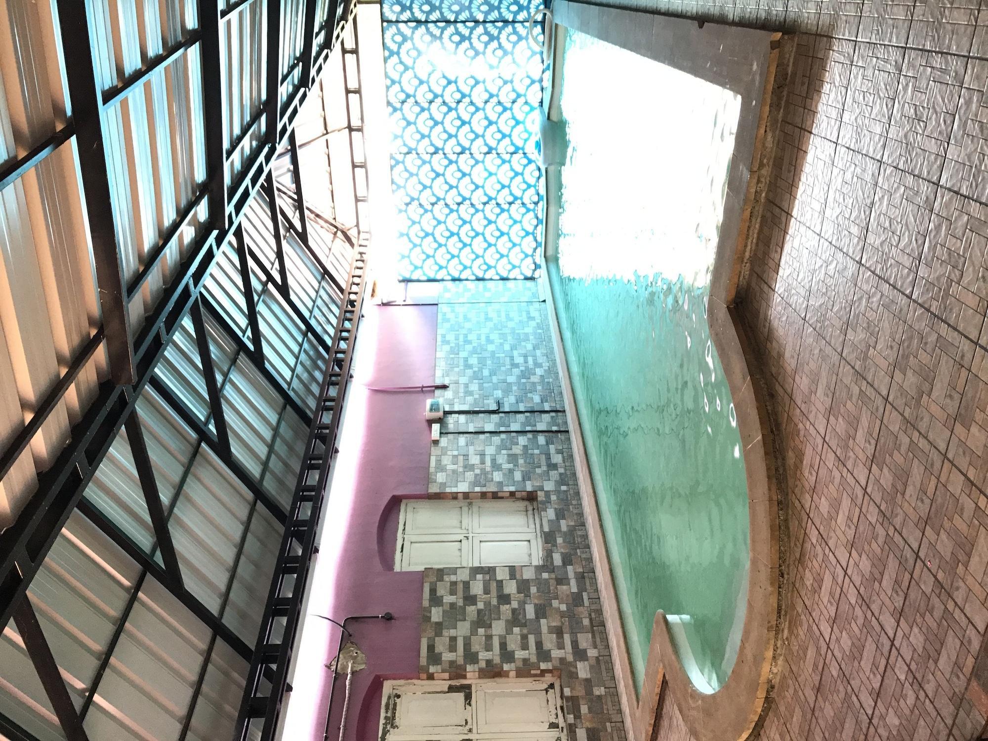 Vista Piscina Palm Rivera - Hostel