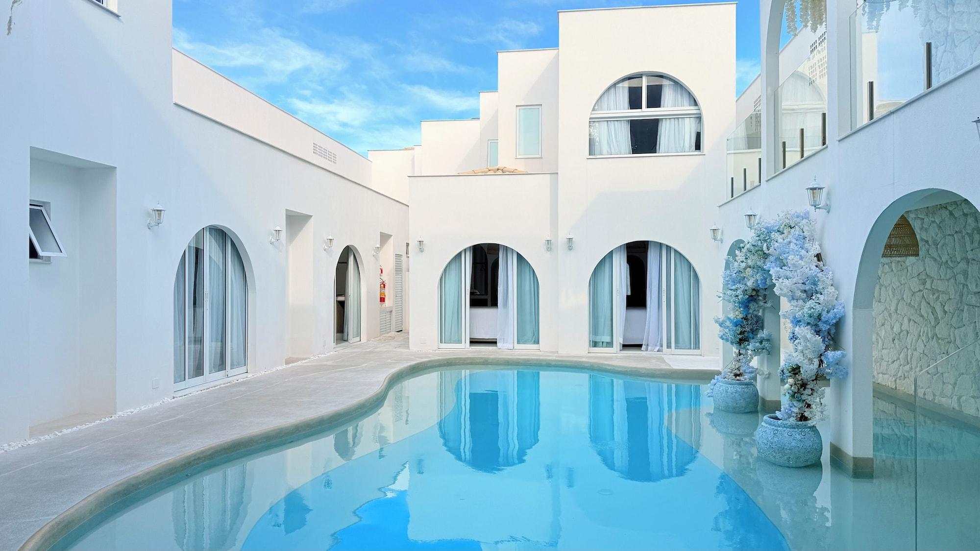 Vista da piscina D Blue Búzios Hotel Boutique