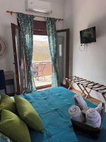 Alquiler Vacacional - Land Of Olive A traditional stone housewith  pool in Ano Styra
