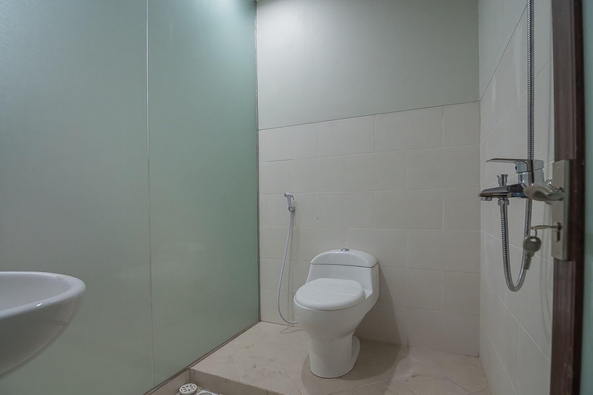 Equipamiento de Habitación Aziz Guest House Syariah