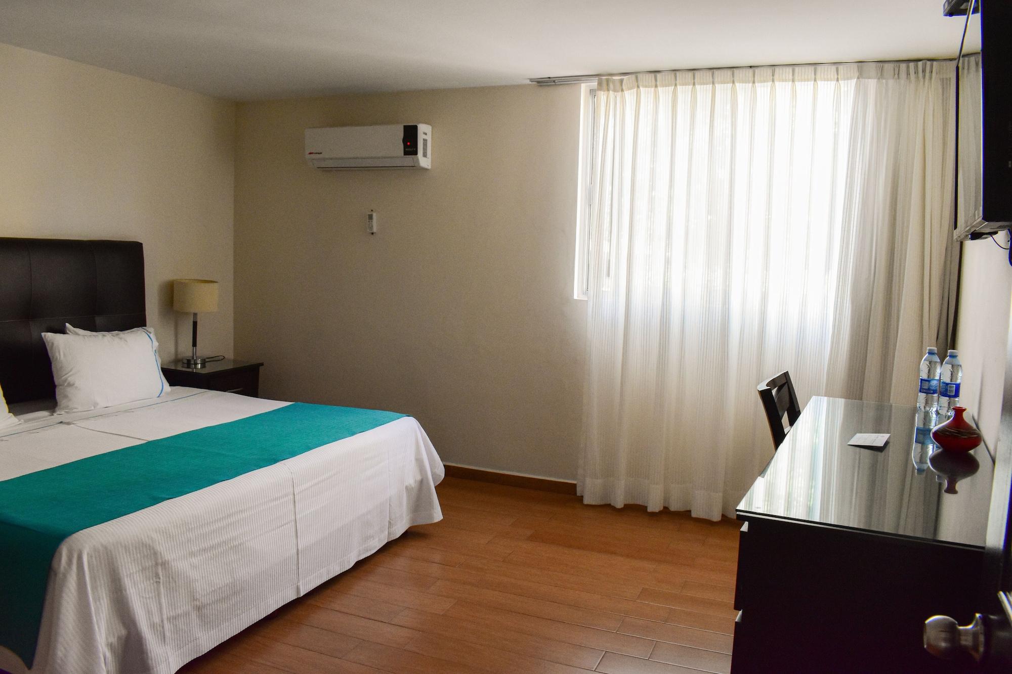 Habitación Country Hotel and Suites