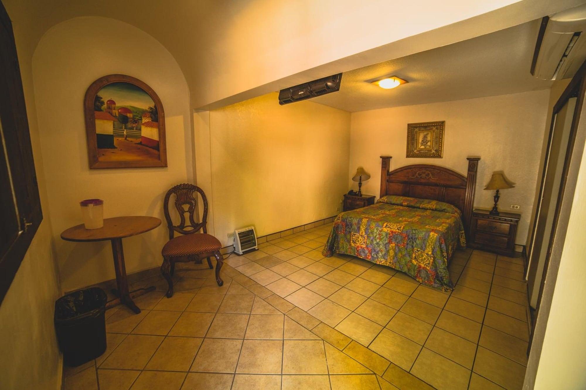 Habitación Hotel Cosmos Don Carlos