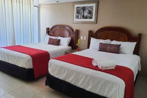 Alojamiento - HOTEL ZONA DORADA SUITES