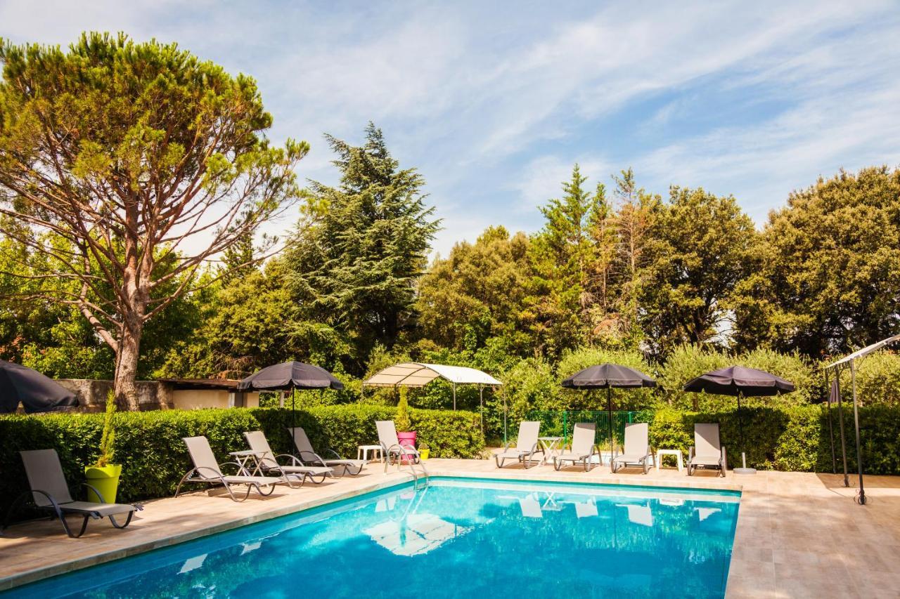 Vista Piscina Logis Hôtel le Petit Manoir