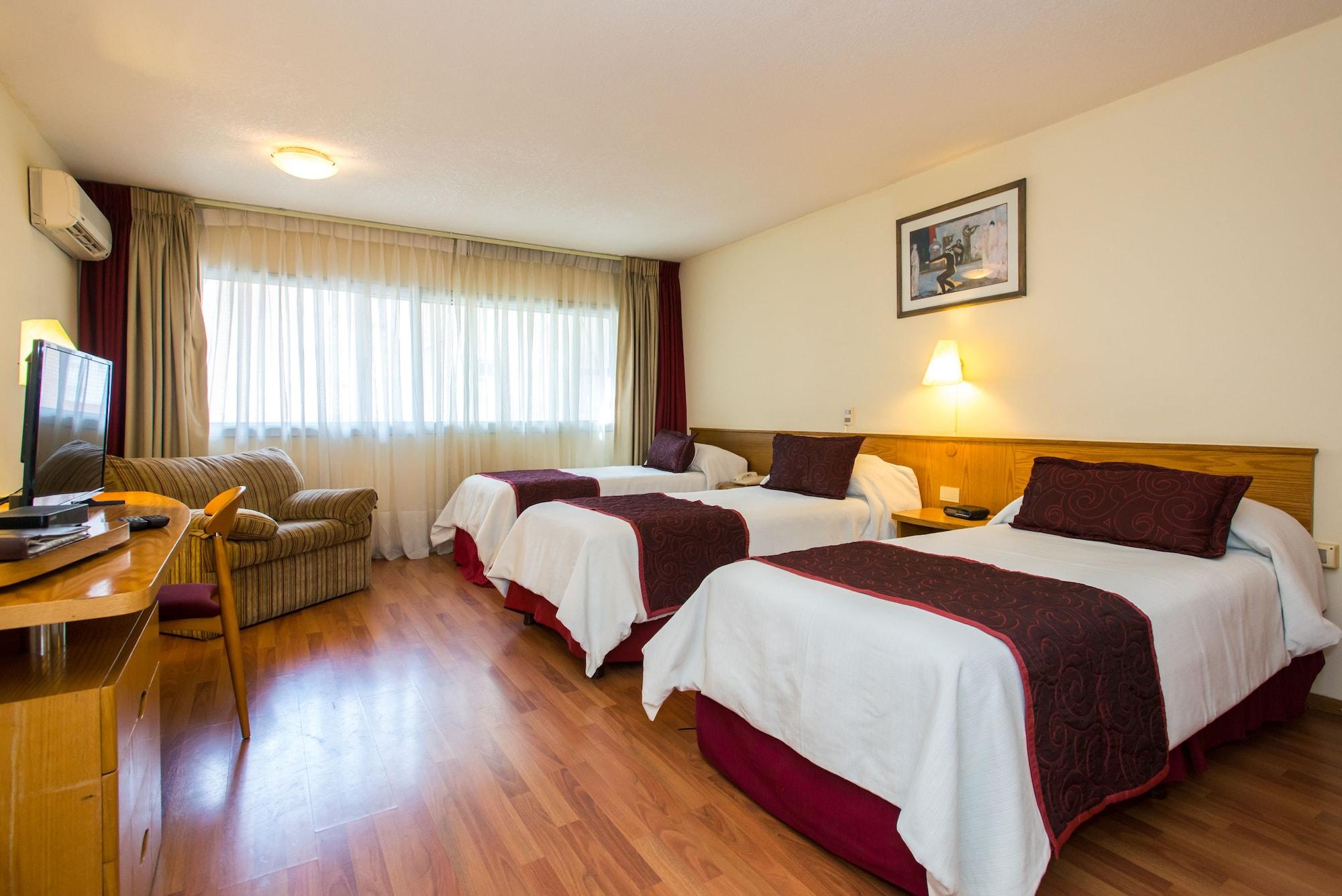 Habitación Armon Suites Hotel