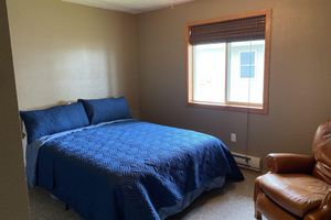 Alquiler Vacacional - Beautiful sunsets on sand beach of Big Spirit Lake front home!