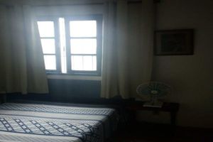 Alquiler Vacacional - home Beach Center, wooded and grassy yard with fruit trees.