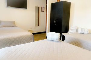 Alquiler Vacacional - Cozy 1-bedroom for families at Inn. WiFi and AC. In Guatemala. Close airport.